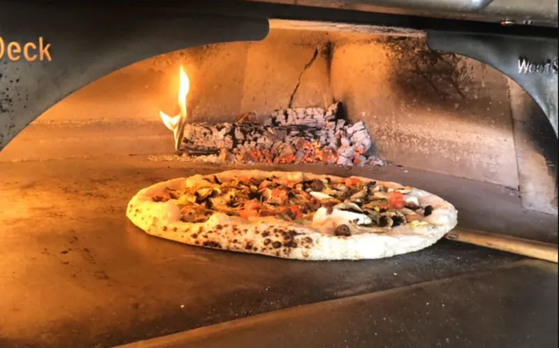 Pizza in the wood-fired oven at Phillies Pizzeria
