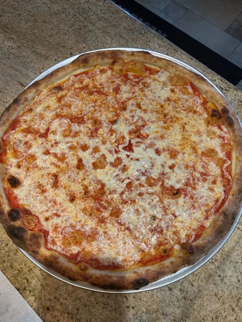 Fresh cheese pizza at Phillies Pizzeria
